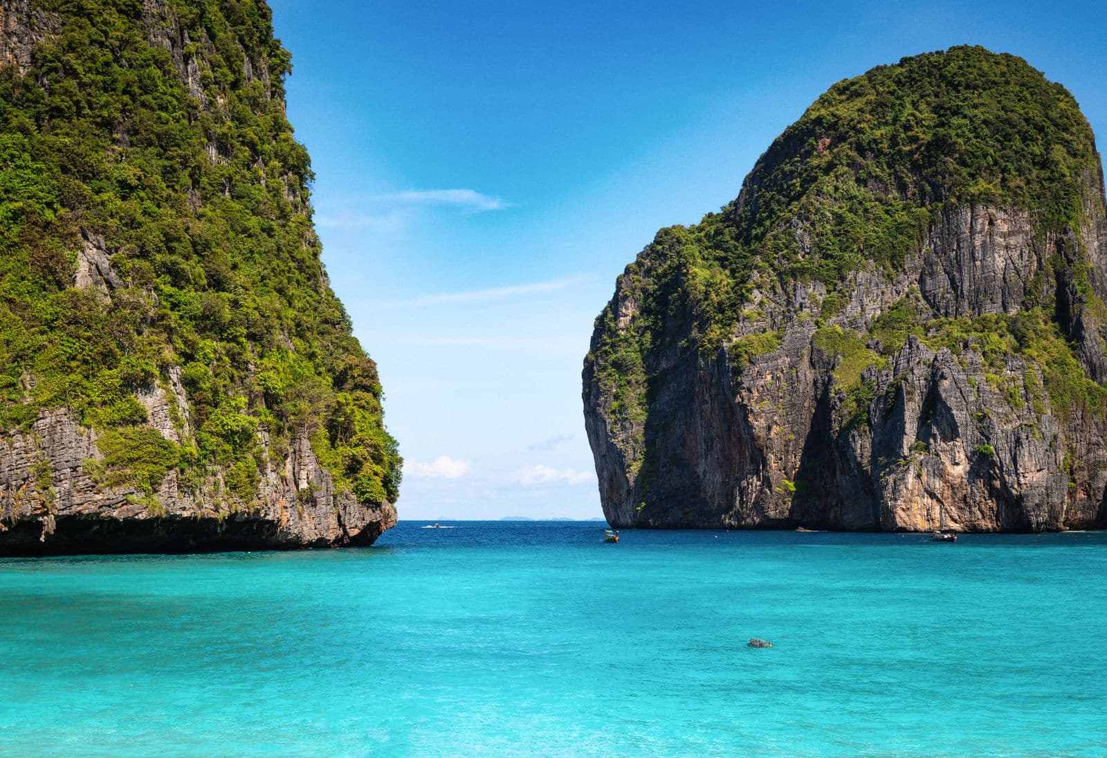 Krabi limestone cliffs beside clear water