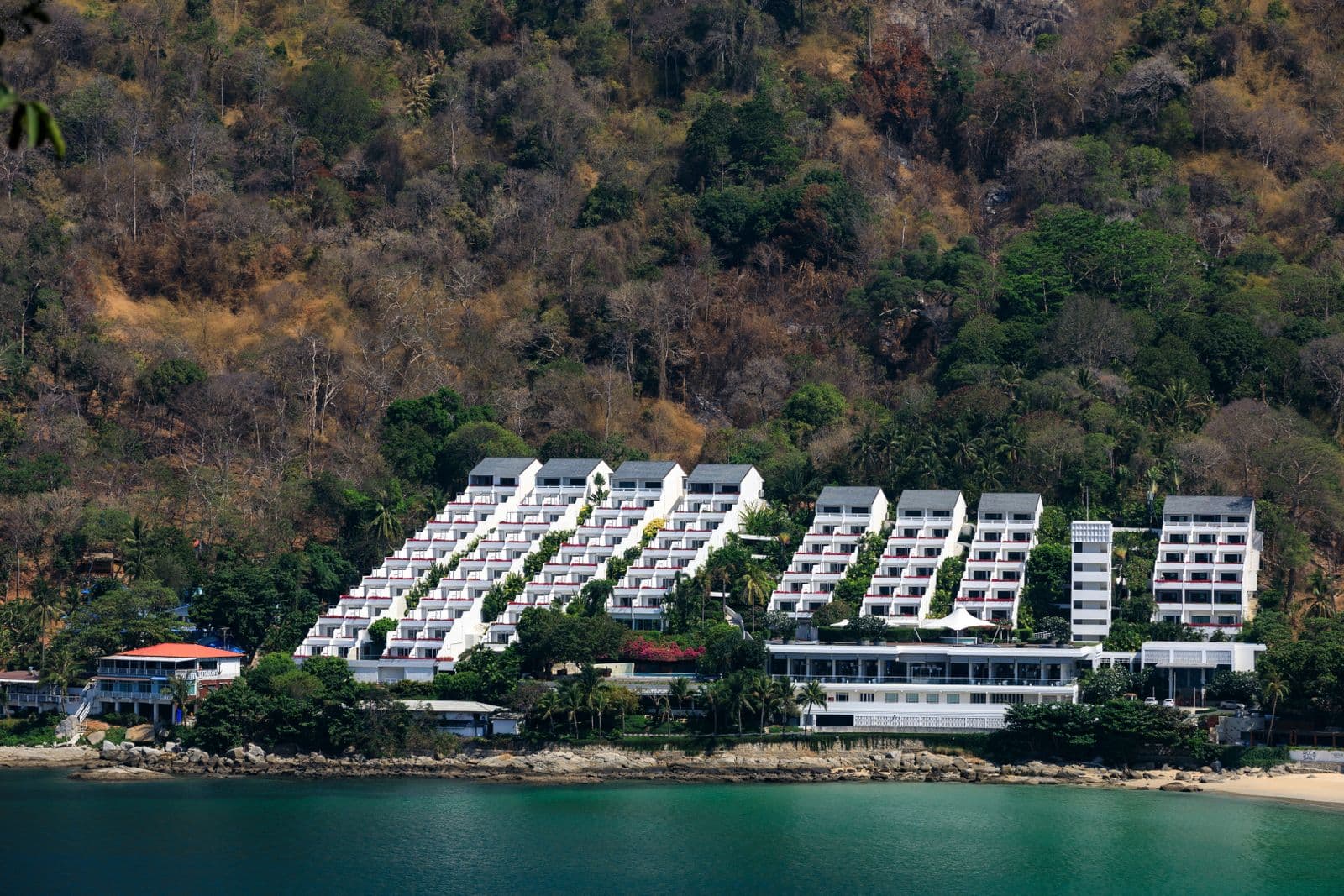Green hillside guesthouse above the Phuket coast